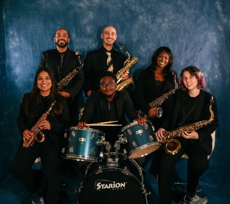 Members of the Tampa Bay Saxophone Collective sitting together smiling